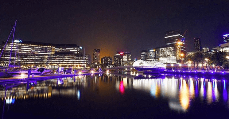 a bridge lit up at night