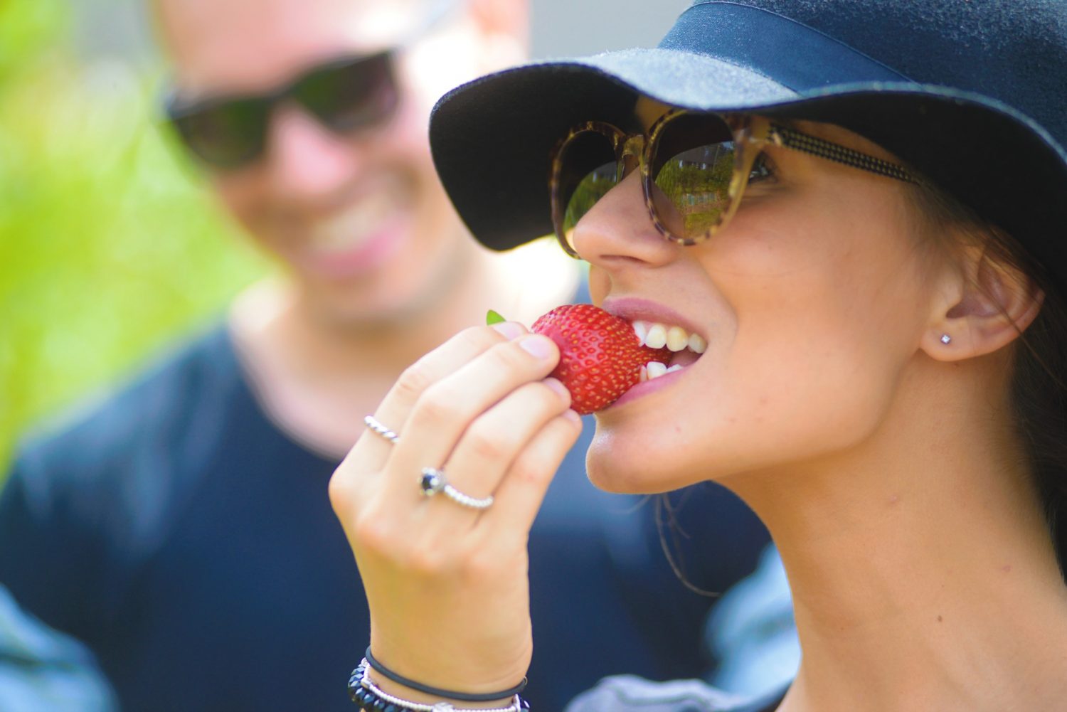 a woman wearing a hat and glasses