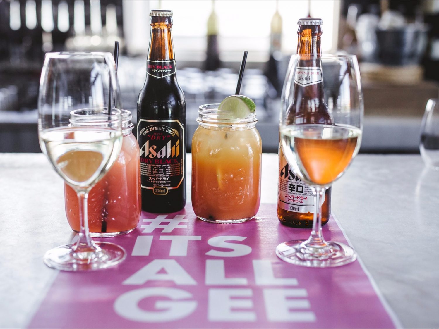 a bottle of wine and a glass of beer on a table