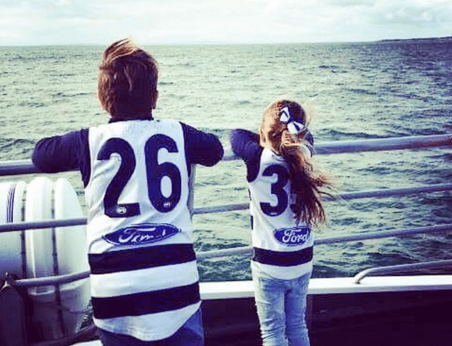 a person standing next to a body of water