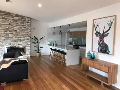 a living room filled with furniture and a fireplace