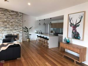 a living room filled with furniture and a fireplace