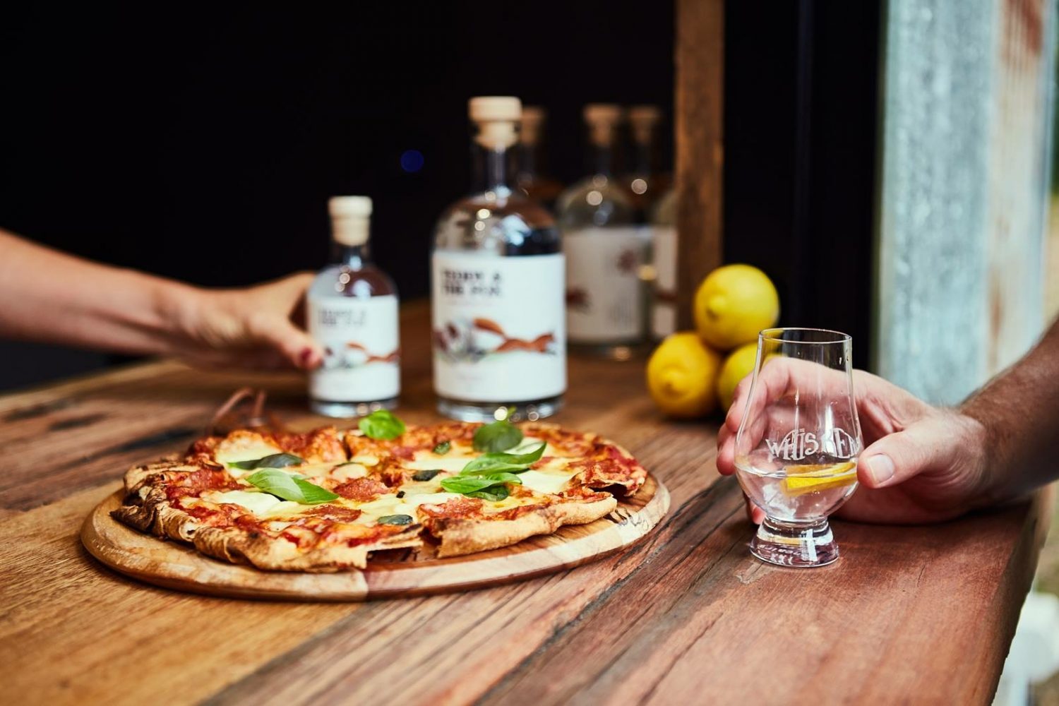 a pizza sitting on top of a wooden cutting board