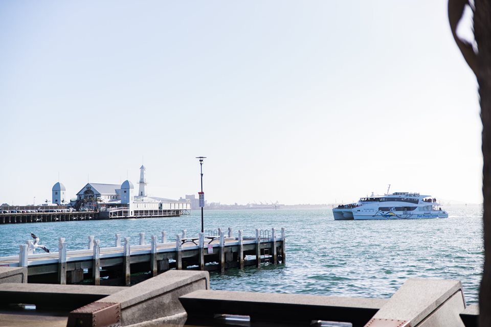 a boat that is sitting on a dock next to a body of water