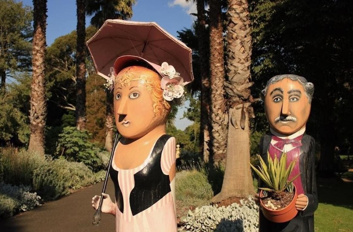 a person standing in front of a statue