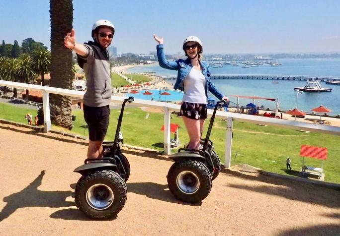 a man riding a skateboard up the side of the road