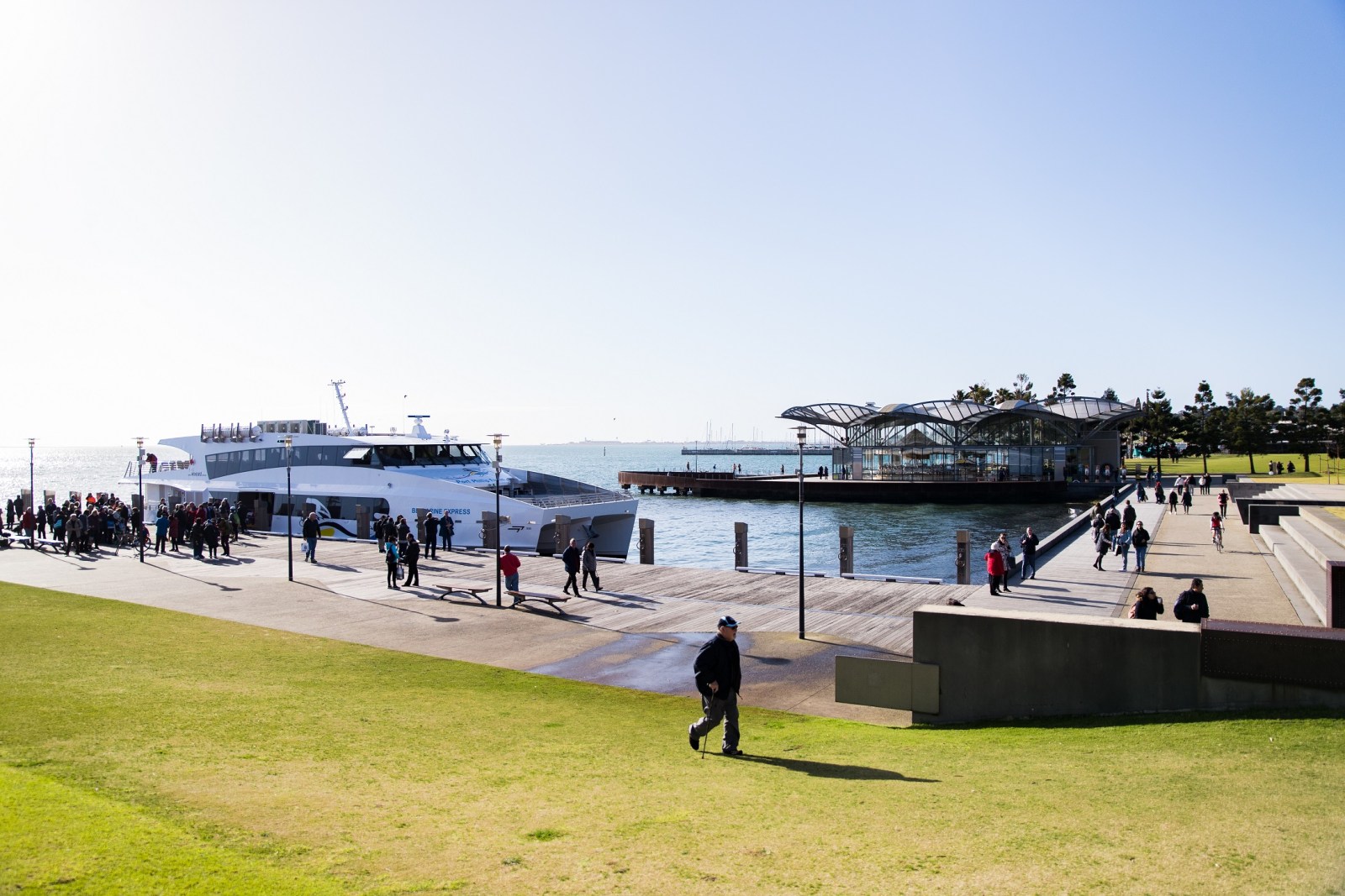 a group of people that are standing in the grass