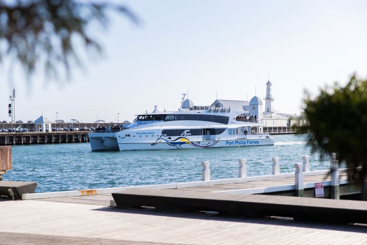 a boat is docked next to a body of water