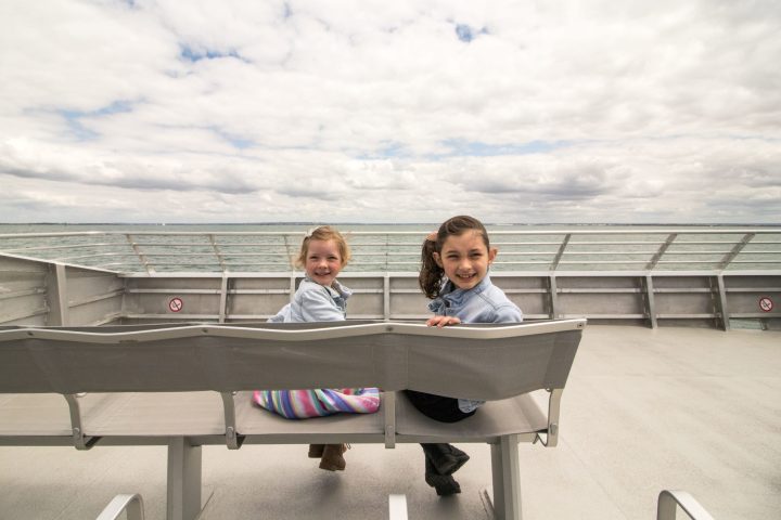 a boy sitting on a bench