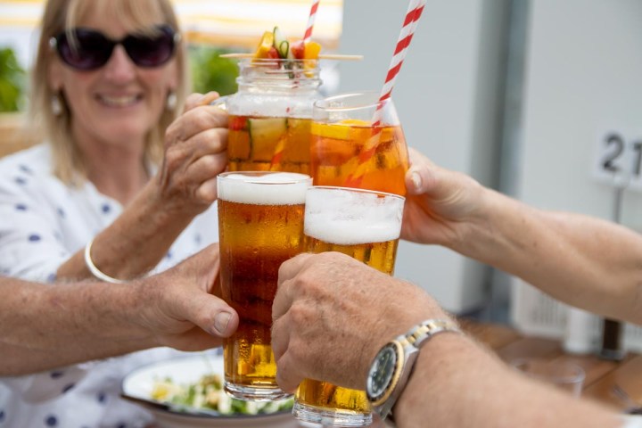 a man holding a glass of wine