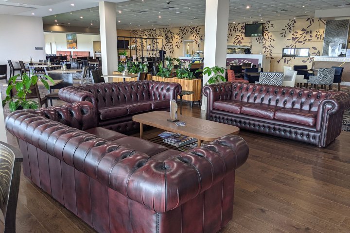 a living room filled with furniture and a fireplace