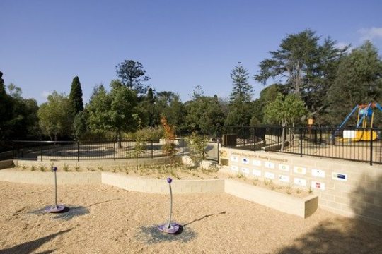 a person sitting in a parking lot