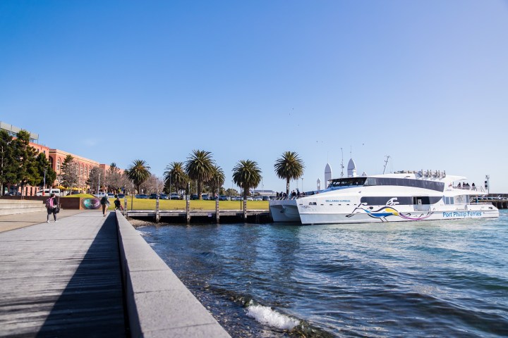 a boat is docked next to a body of water