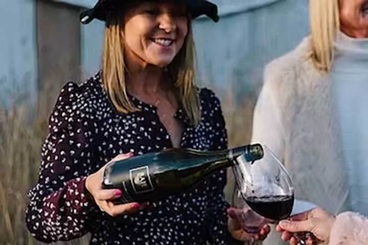 a woman holding a wine glass