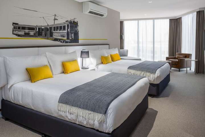 a bedroom with a bed in a hotel room