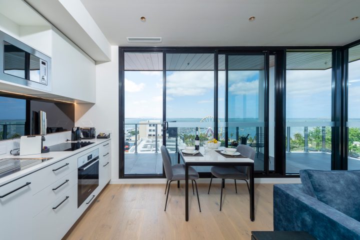 a room filled with furniture and a large window