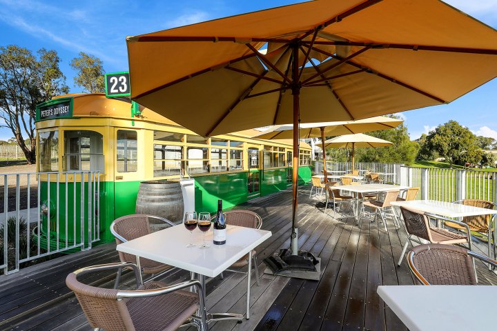 a couple of lawn chairs sitting on top of a table