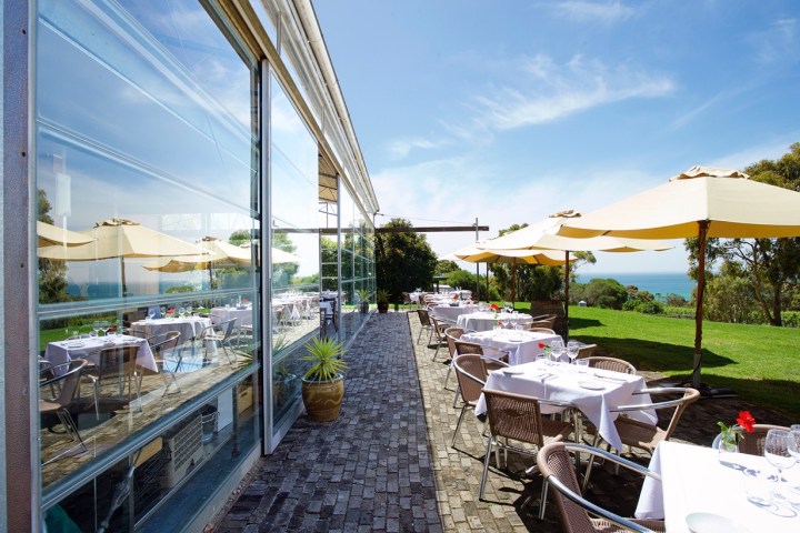 a group of people sitting at a train station