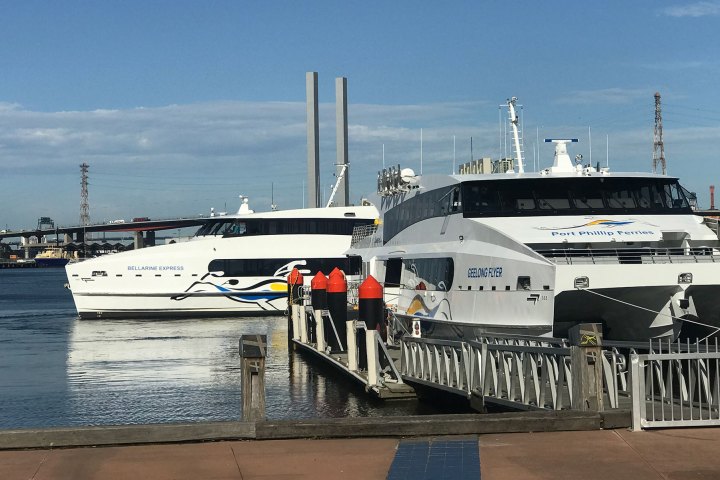 a boat is docked next to a body of water