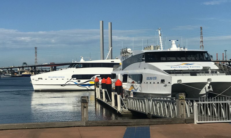 a boat is docked next to a body of water