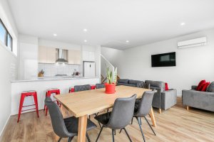 a living room filled with furniture and a wood floor