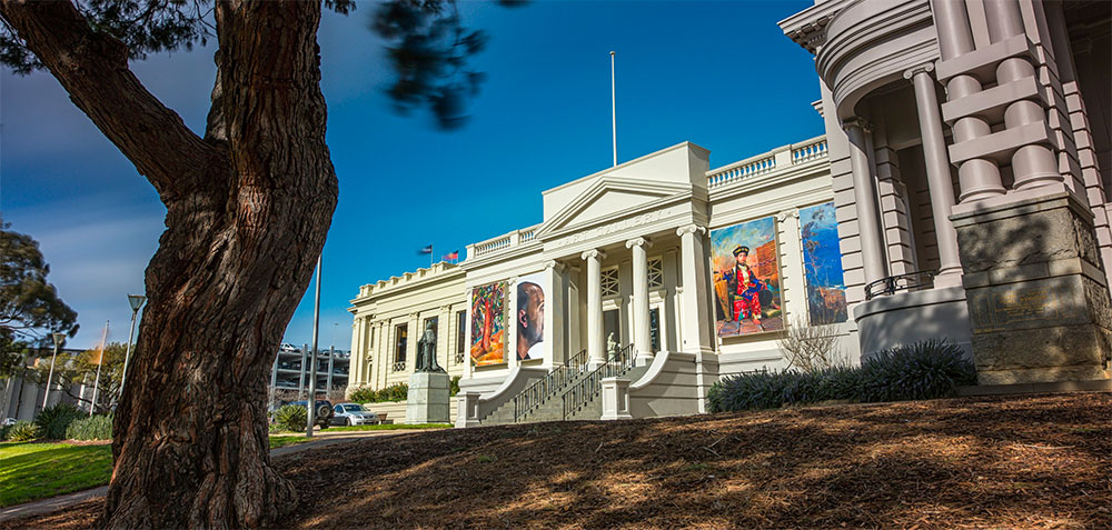 a clock tower in front of a building