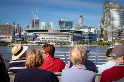 a group of people looking over a city