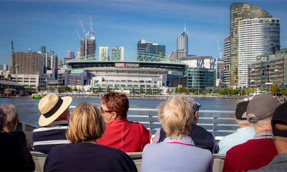 Multi-Trip-Pass-Balance a group of people looking over a city