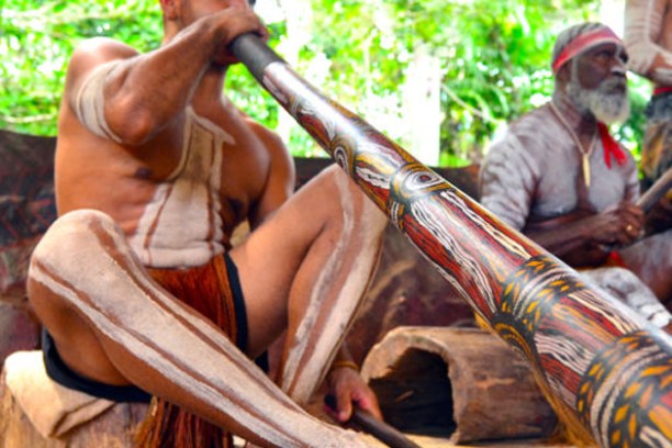 a group of people sitting on a bench