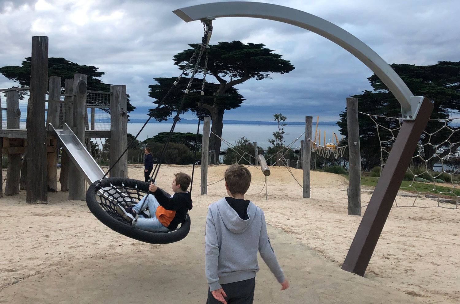 a person that is standing in the sand