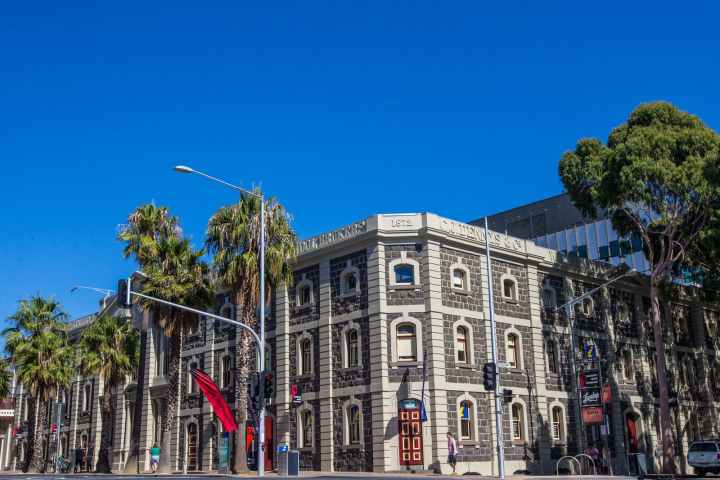 a group of people in front of a building