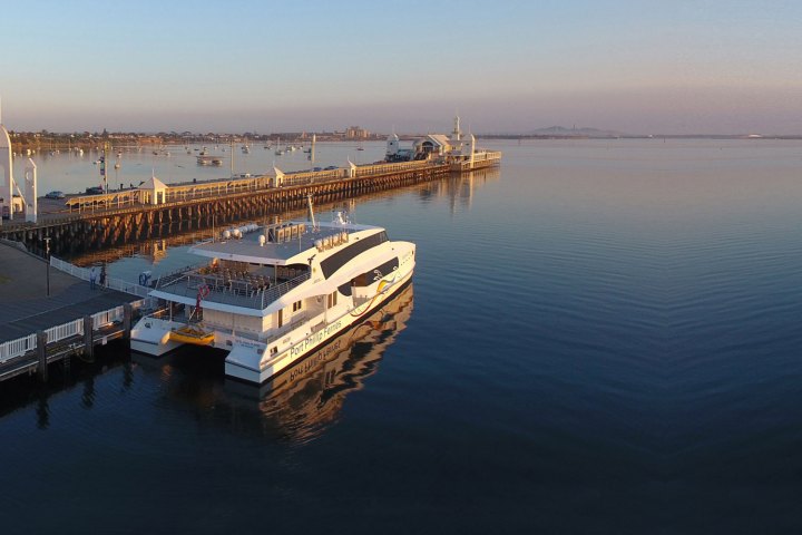 a boat is docked next to a body of water