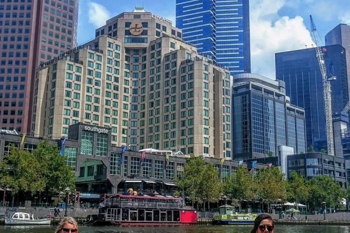a group of people in a boat on a body of water