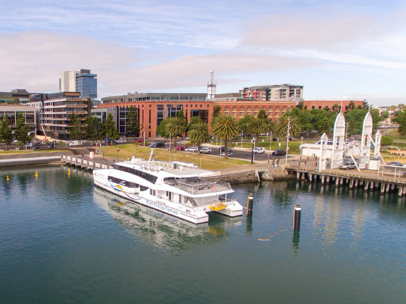a small boat in a harbor next to a body of water