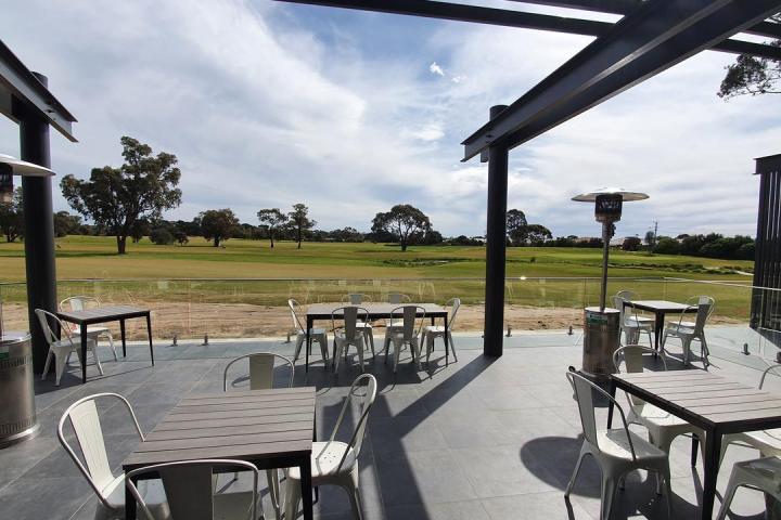 a chair sitting in front of a building