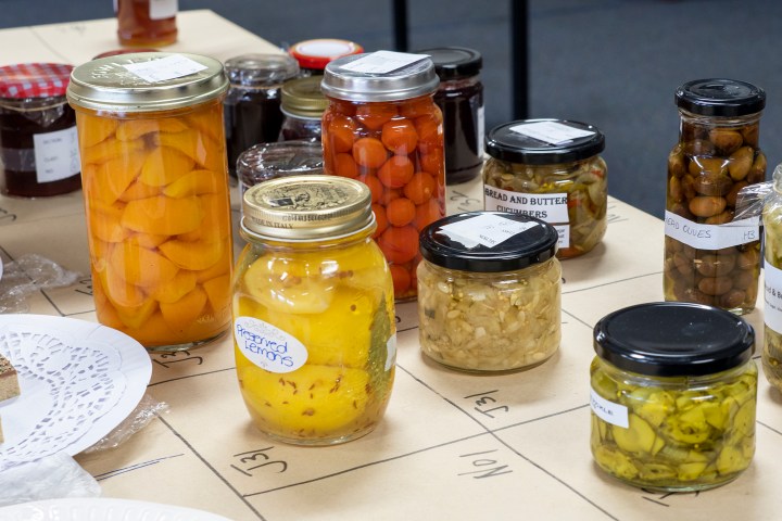 a blender sitting on top of a table full of food