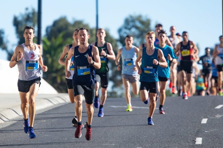 a group of people walking down the street