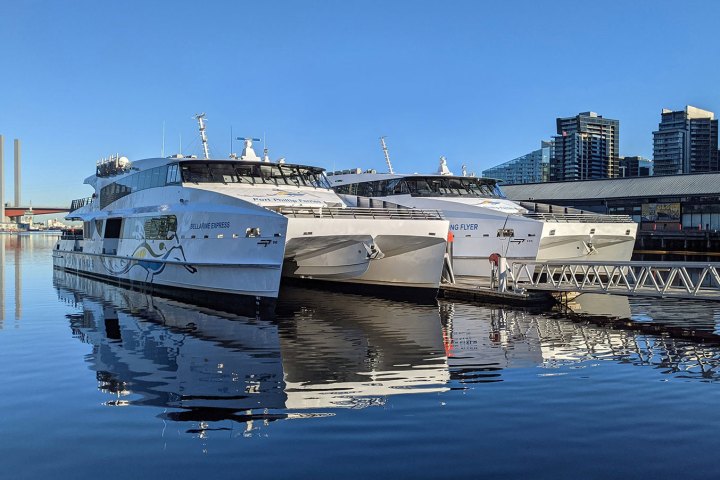 a boat is docked next to a body of water