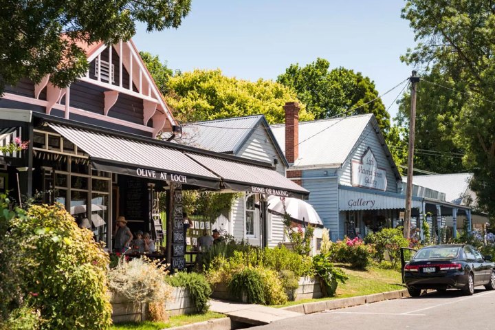 a close up of a street in front of a house