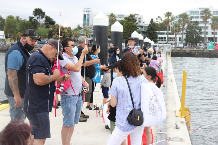 a group of people walking down the street