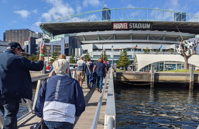 a group of people standing on a bridge