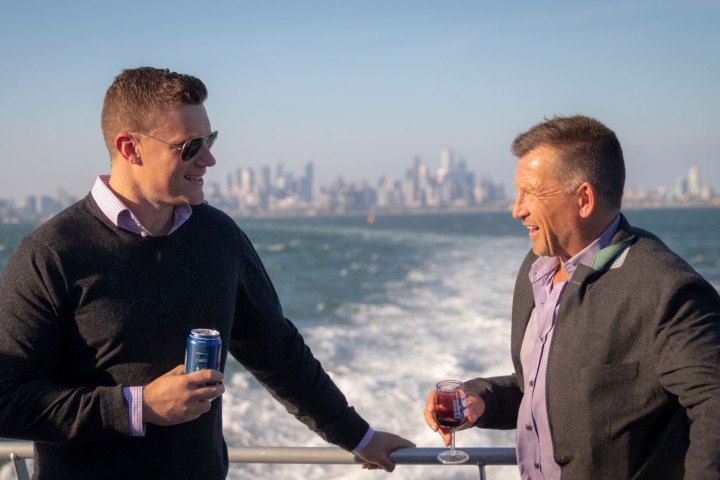 a man holding a glass of water