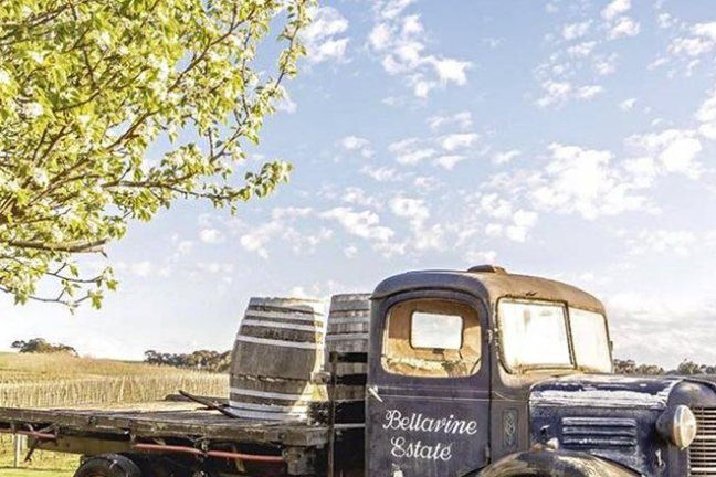 a truck driving down a dirt road
