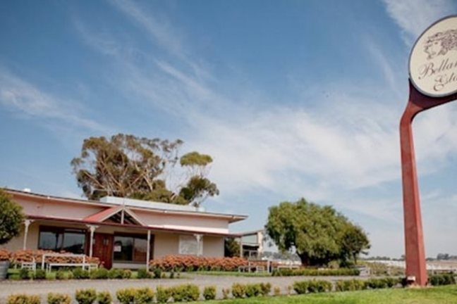 a sign in front of a house