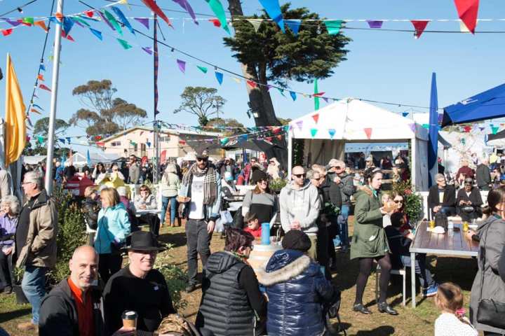 a group of people standing in front of a crowd