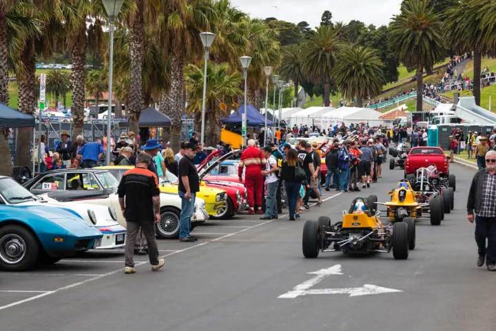 a group of people riding on the back of a truck