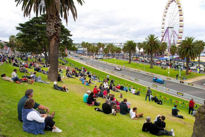 a group of people sitting at a park