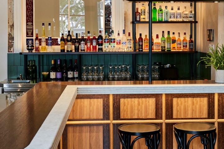 a kitchen with a table in front of a window