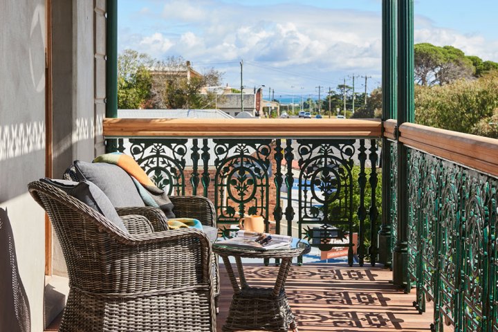 a chair sitting in front of a window
