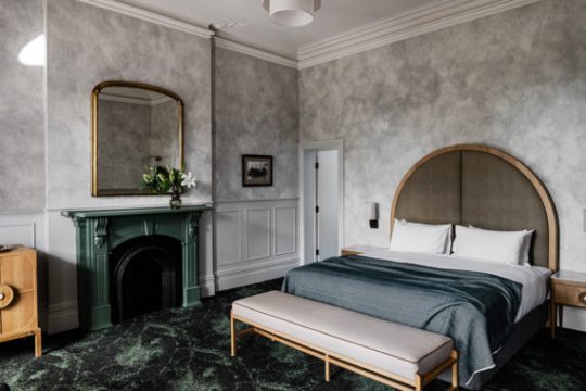 a living room filled with furniture and a fireplace